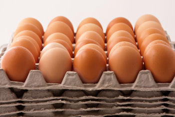 Open flat carton of eggs.