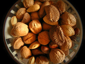 English walnuts, brazil nuts, pecans in bowl.