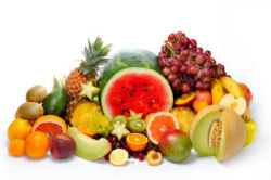 Grouping of various fruits, including watermelon, grapes, oranges and pineapple.