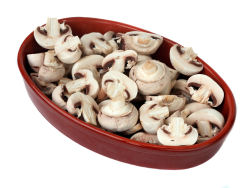 Bowl of whole and sliced mushrooms.