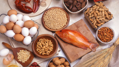 photo of various foods in a grouping, lobster, eggs, seeds, nuts, etc.