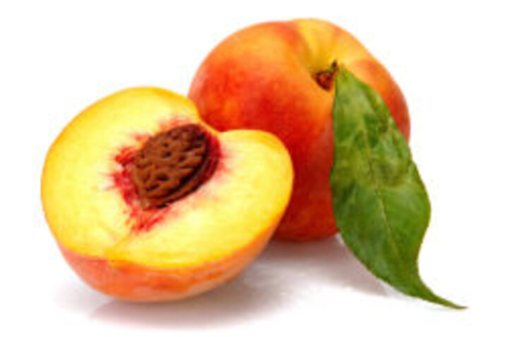 photo of whole and halved peach