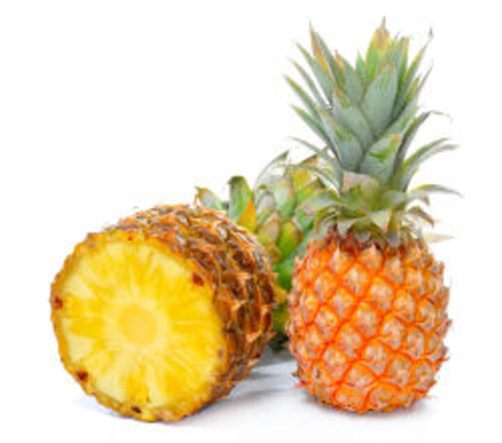 photo of whole and halved pineapple